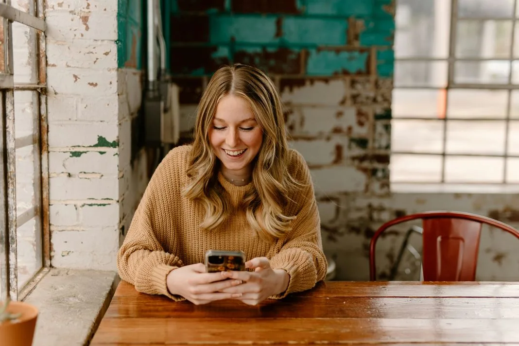 A photo of a happy customer who is getting more business from their website.
