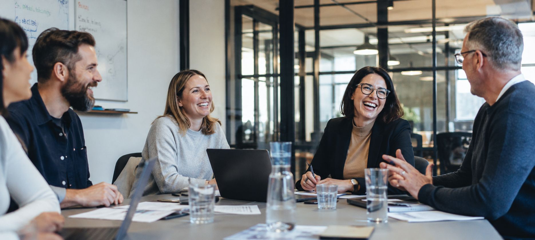 A photo of happy local business owners having a meeting about their website performance and SEO