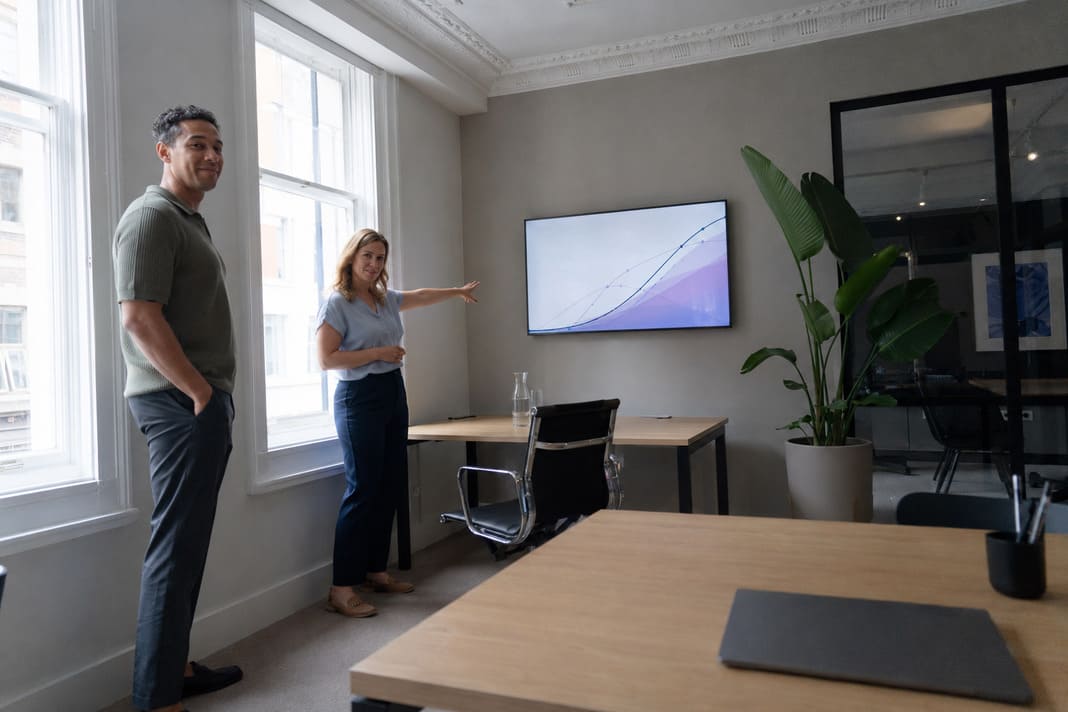 AI SEO professionals analysing search performance in a quiet London office