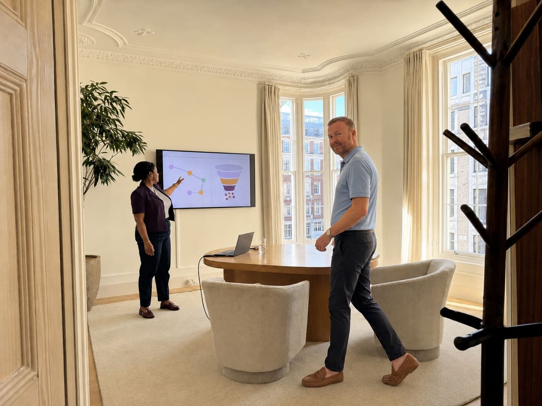 Digital SEO consultants discussing recommendation journeys in a modern strategy room