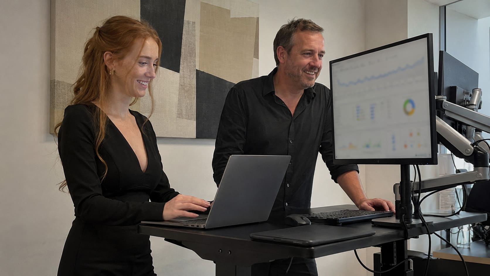 SEO colleagues comparing keyword rankings and search performance data
