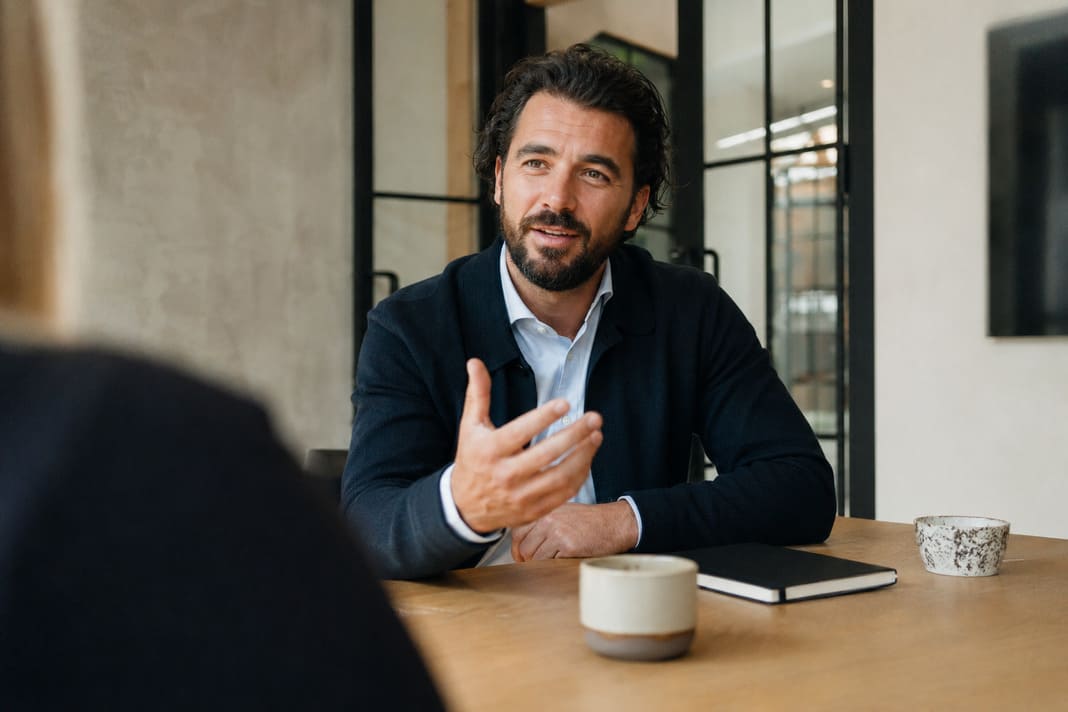SEO consultant explaining digital marketing strategy to client.
